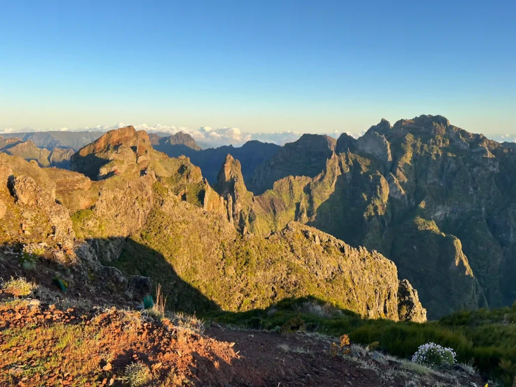 Sun rising over the surrounding mountains at the Pico to Pico hike in Madeira.