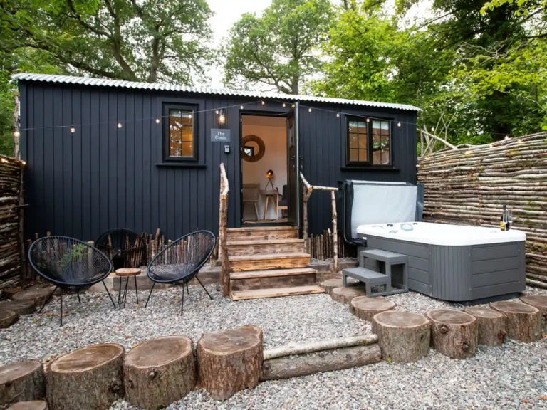 The Mar Huts accommodation featuring the beautiful hut with fairy lights and a hot tub outside.