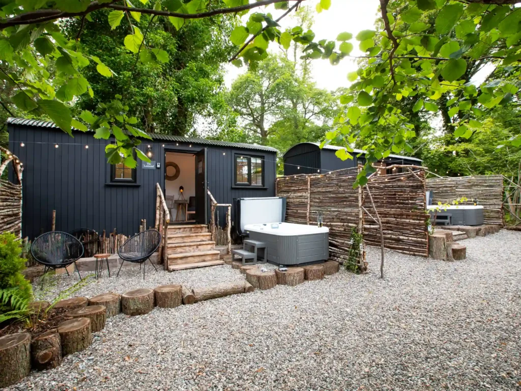 Exterior of the Mar Huts in Loch Lomond showing the cabins and hot tubs.