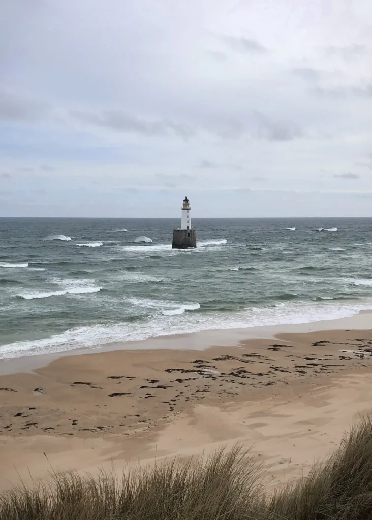 Rattray Head Lighhouse on a stormy cloudy day in Scotland.