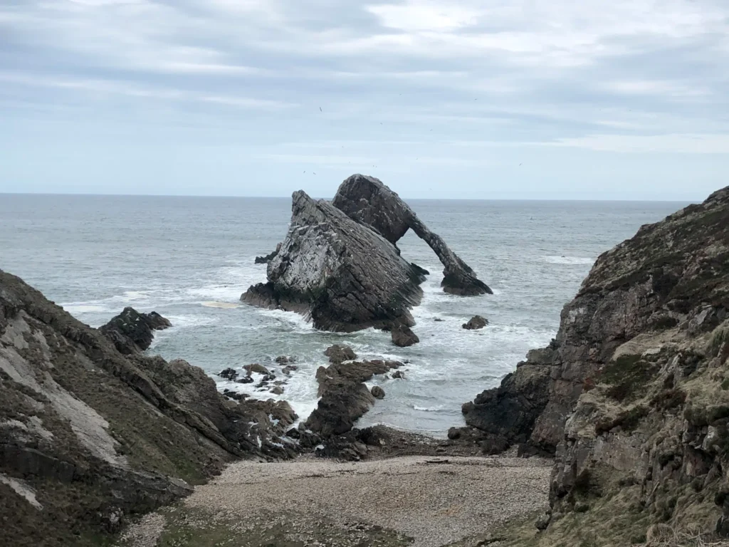 Bow Fiddle Rock in Scotland on a cloudy day.