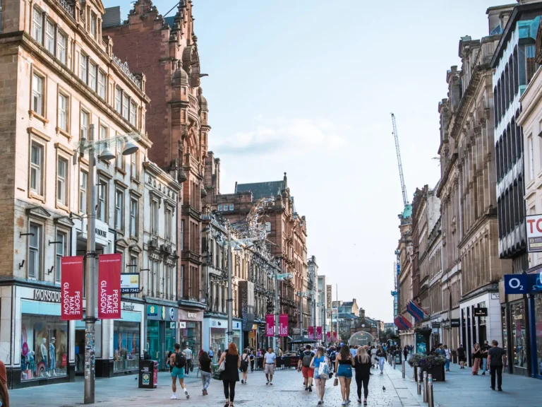 Busy buchanan street in Glasgow on a clear sunny day.