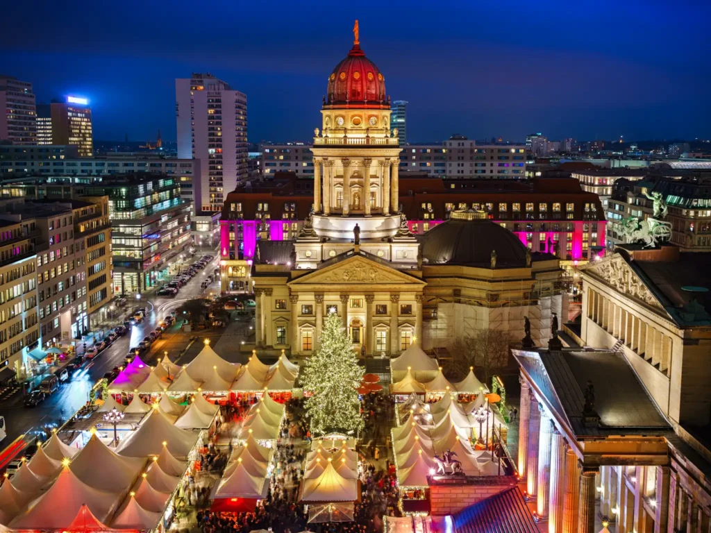 Aerial shot of the Christmas Market in Gendarmenmarkt in Berlin at night.
