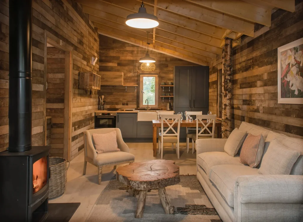 The living room and kitchen of the Nuthatch Lodge at Treehouses At Lanrick.