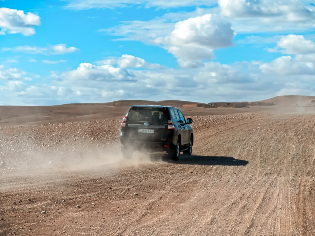 4x4 off roading in Agafay Desert in Morocco on a sunny day.