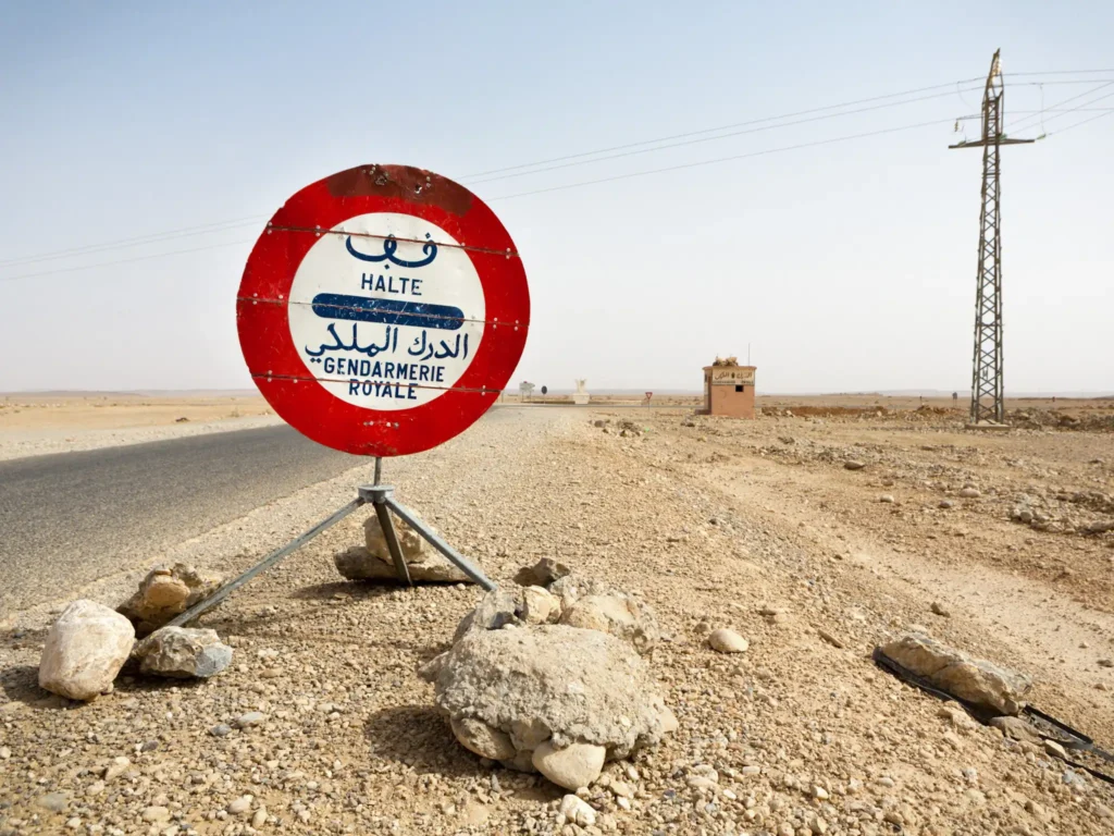 Police checkpoint sign on a empty road in Morocco.