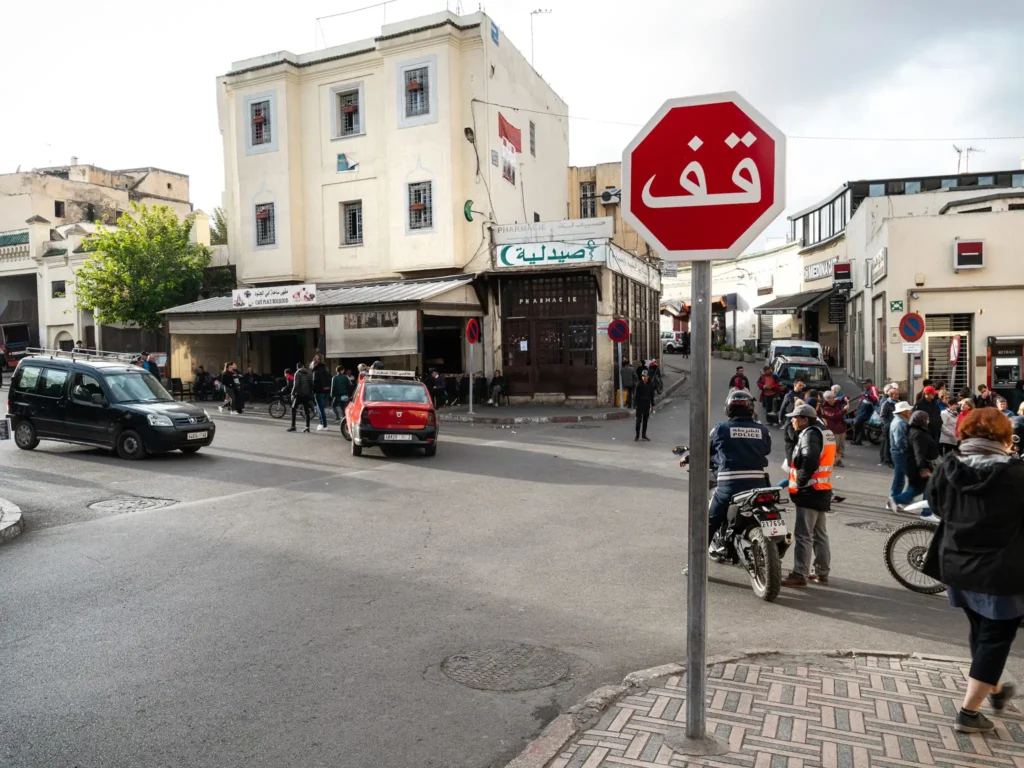 Stop sign at a busy intersection in Fes in Morocco.