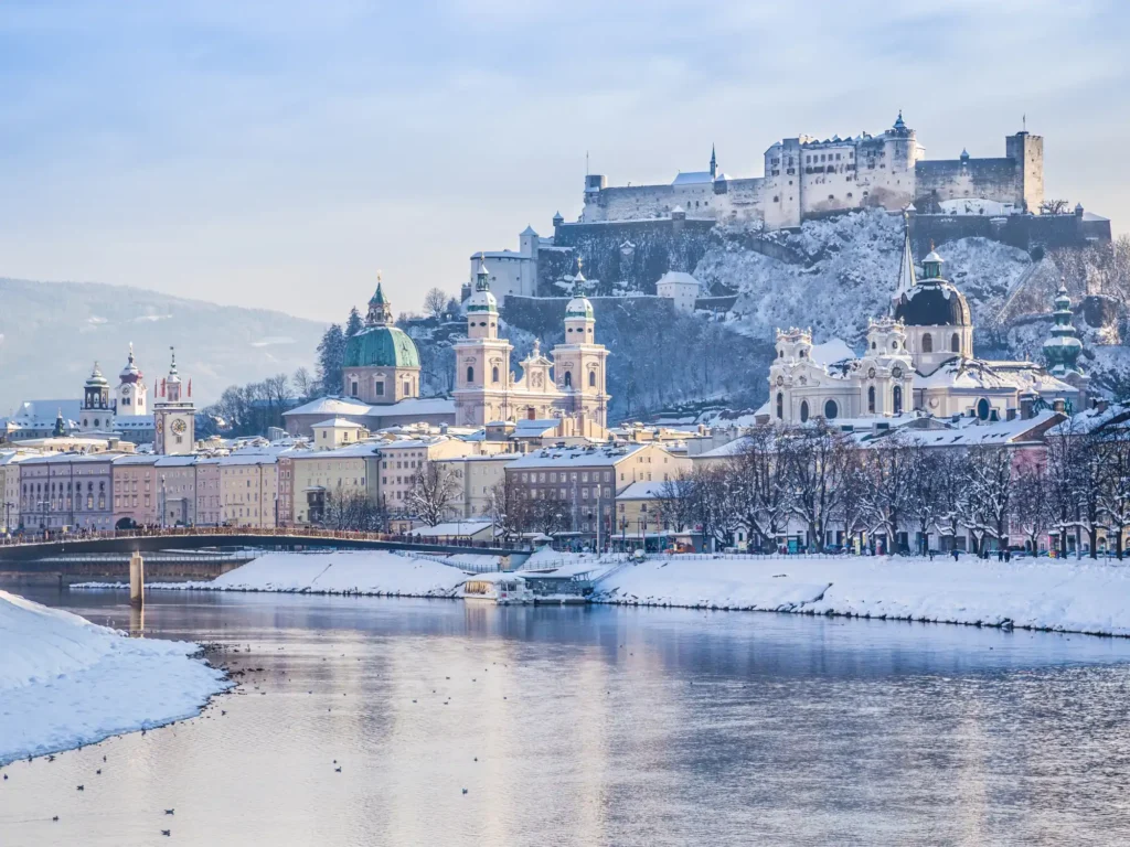 Overlooking snow-covered Salzburg and Fortress Hohensalzburg from the Salzach River. 