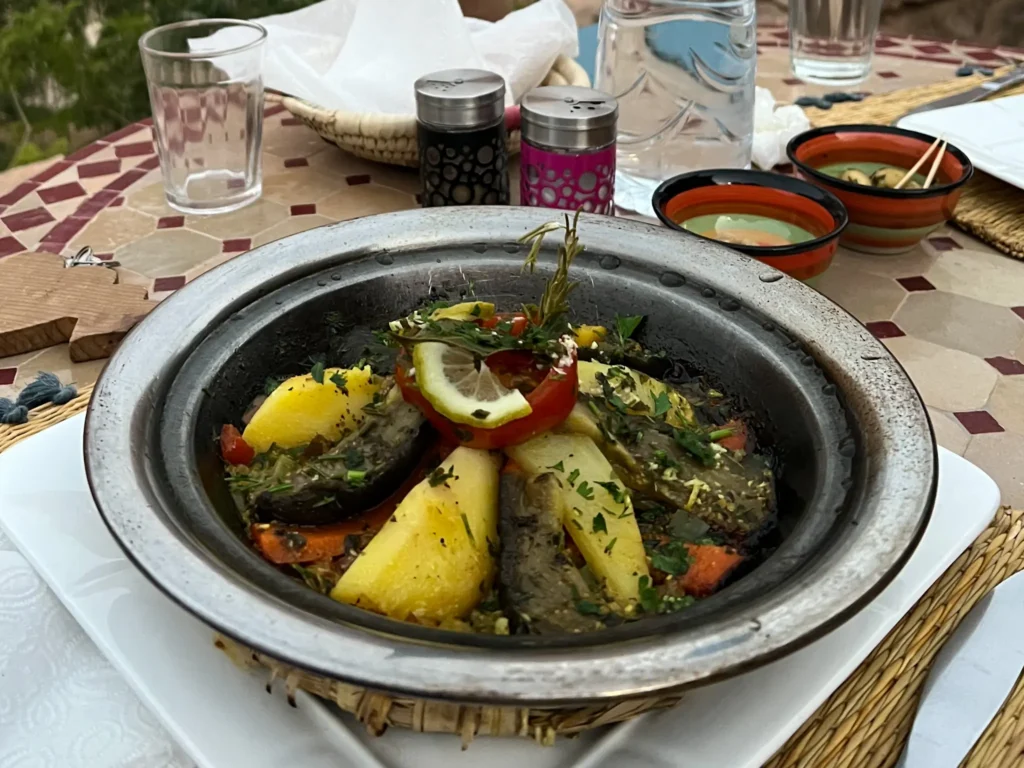 Tagine with water and olives in a restaurant in Tinghir.