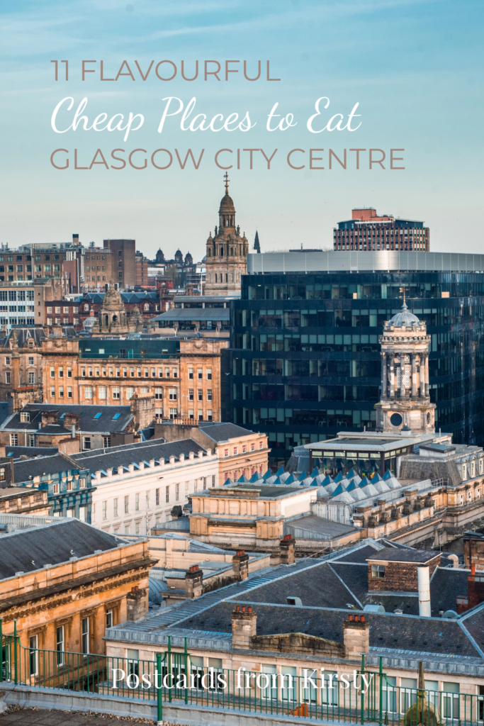 A rooftop view of the mixed architecture of old and new buildings in glasgow city in late afternoon light with text overlay saying "11 Flavourful Cheap Places to Eat Glasgow City Centre" and "Postcards from Kirsty"