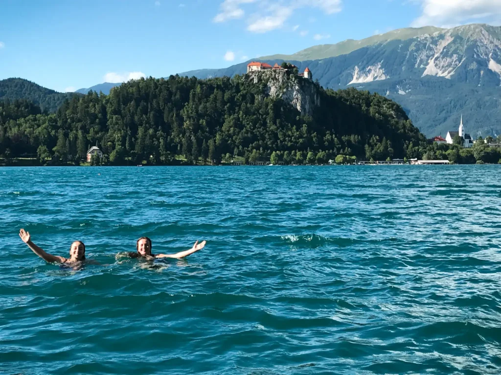 Two girls in the water at Lake Bled in Slovenia.