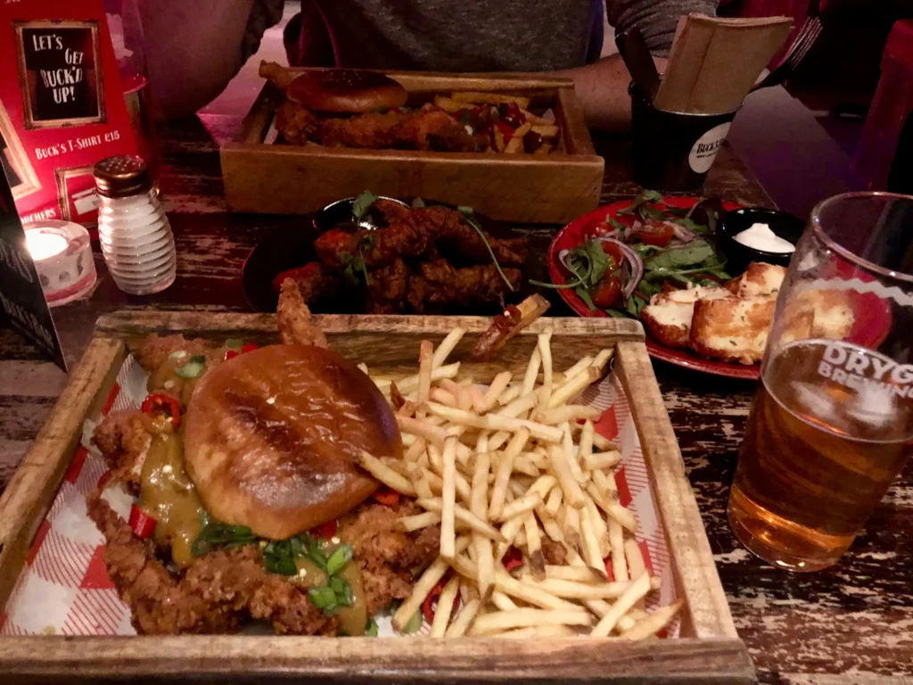Two salt 'n' chilli chicken burgers with a side of halloumi nuggets at Bucks Bar in Glasgow city centre.