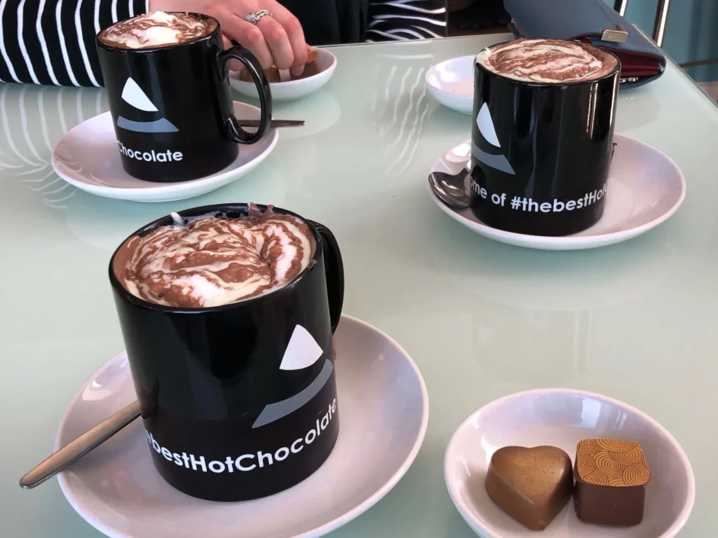Three hot chocolates with chocolates on the side at Cocoa Mountain in Durness.