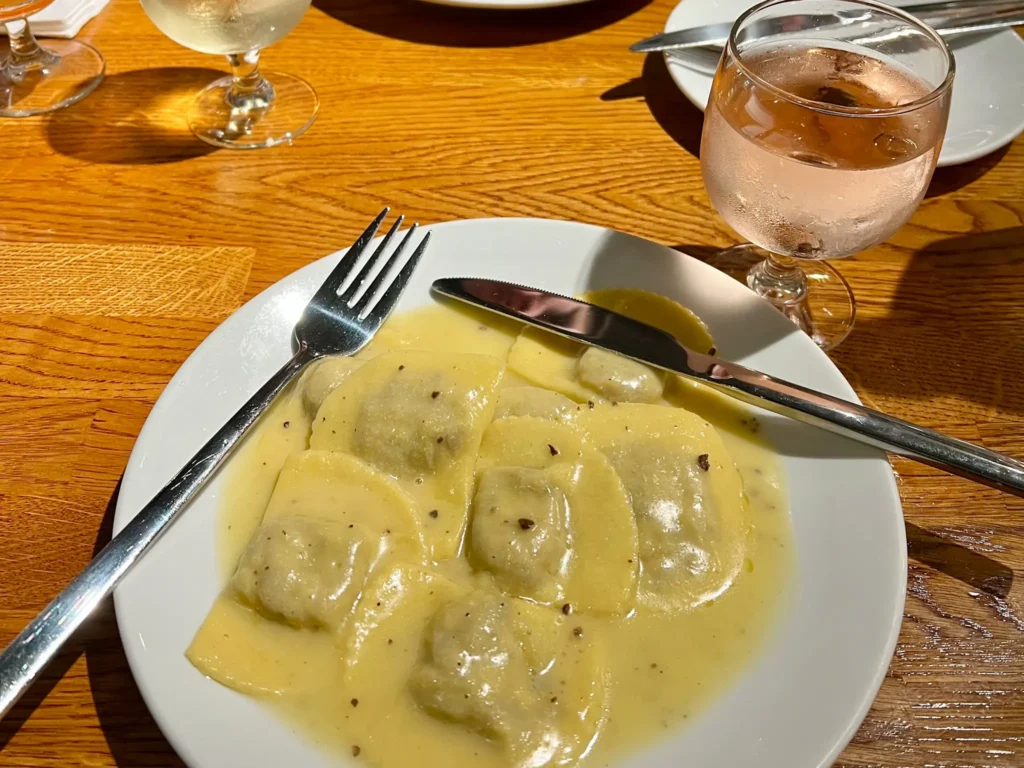 Ravioli pasta and a glass of rose wine from Sugo in Glasgow City centre.