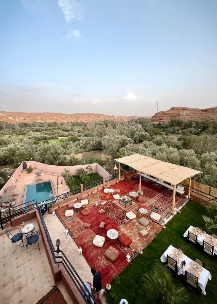 Overlooking Riad Sahara Stars Dades terrace, the pool and the surrounding landscpae from the rooftop terrace.