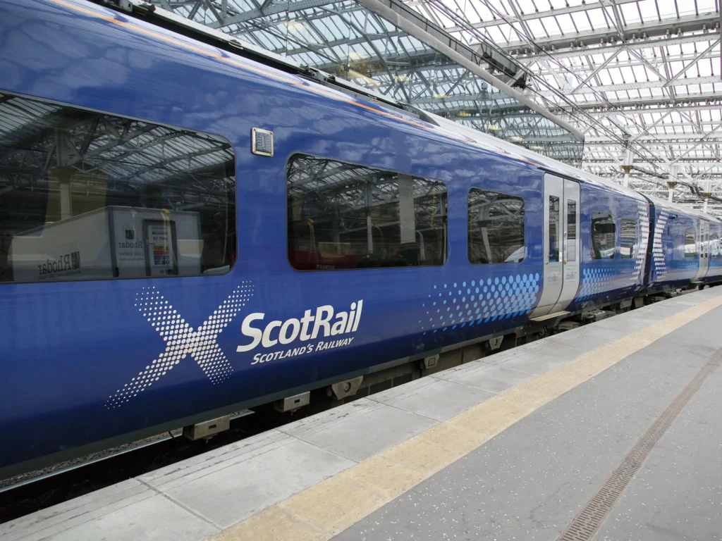 Scotrail blue train waiting in a station in Scotland. 