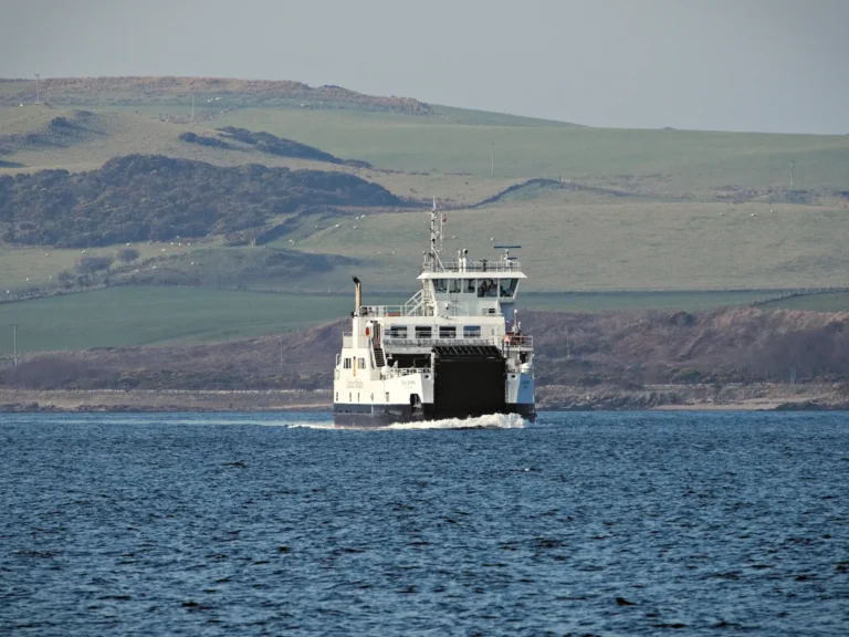 The Largs to Millport ferry boat, Loch Shira, sailing away from Great Cumbrae Island.
