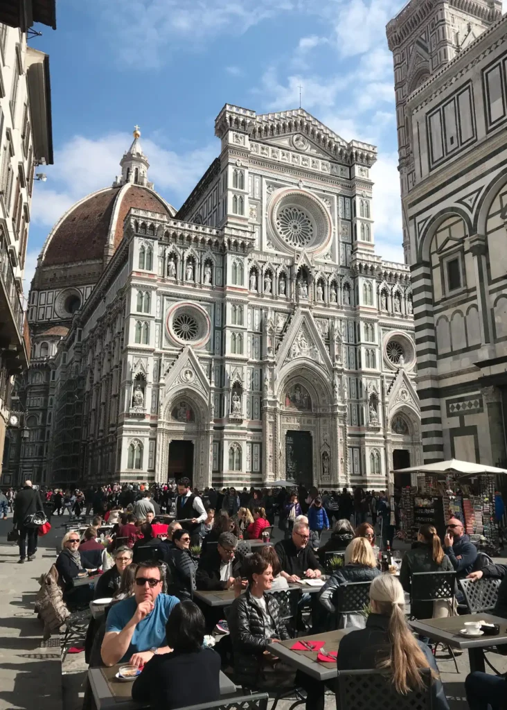 People dining al fresco at cathedral of Santa Maria del Fiore in Florence