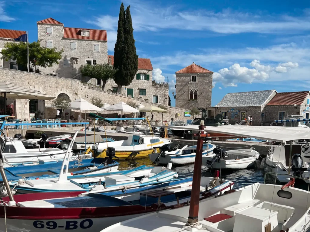 Bol in Brač Croatia with fishing boats and stone buildings.