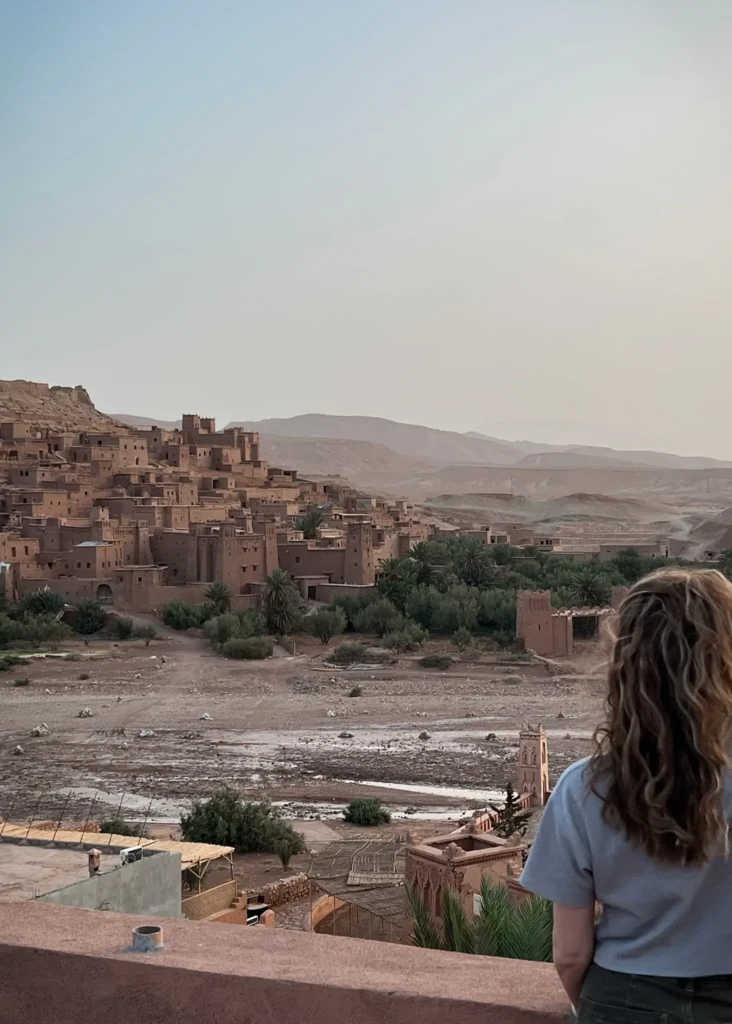 Girl watching the sunrise over Ait Ben Haddou.