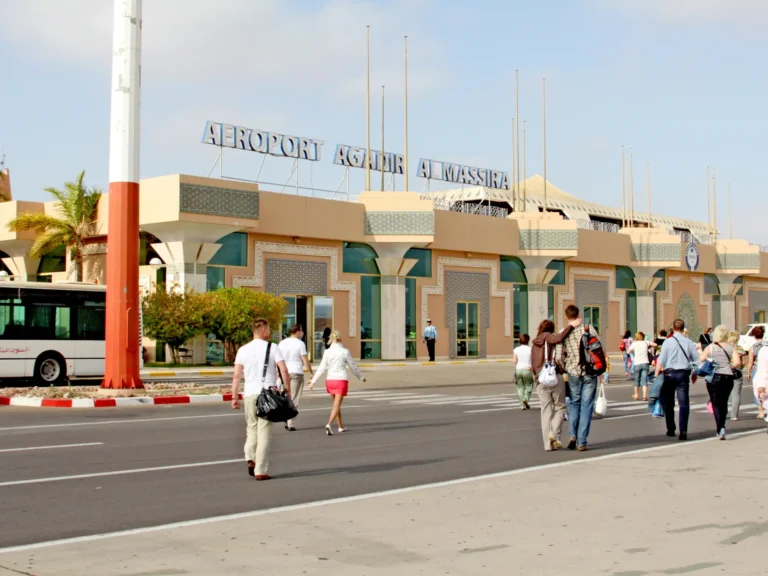 Travellers walking into the al-massira airport in agadir in morocco