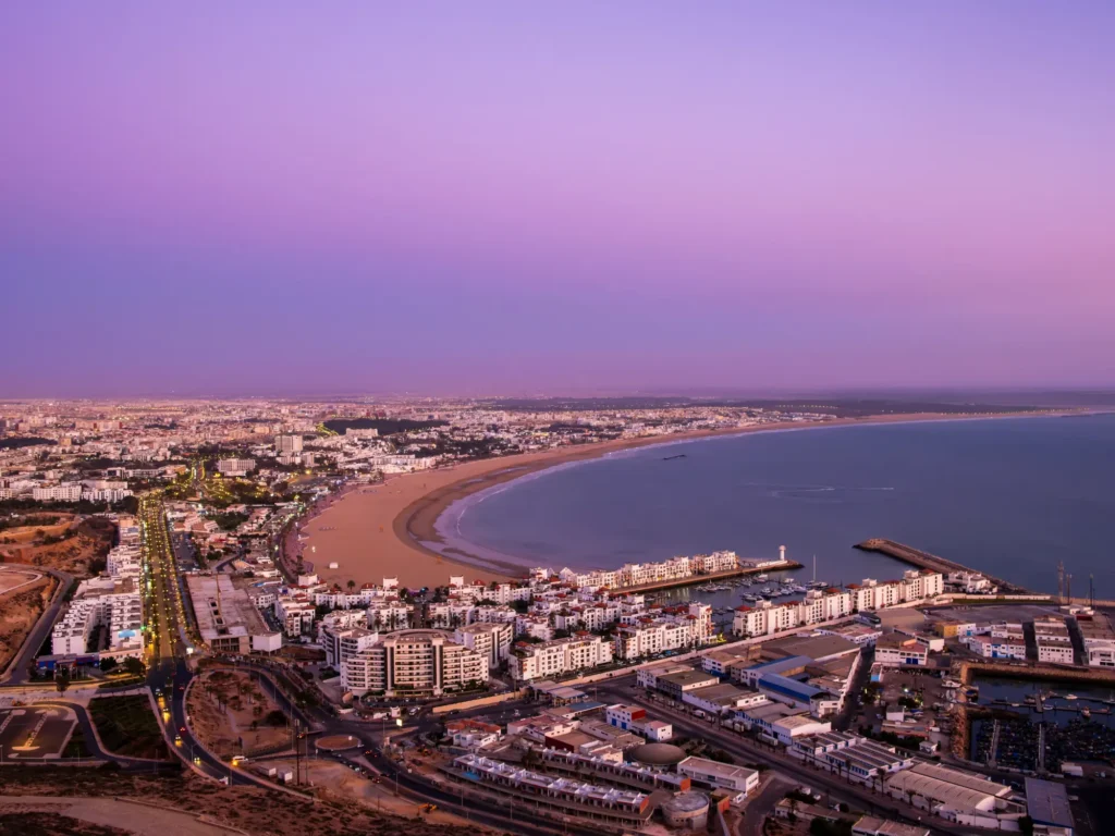 Panoramic view of agadir city and bay in southern morocco with marina, beach and ocean from oufla or casbah fortress.
