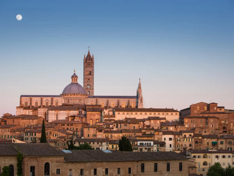 Siena cityscape at sunset with cathedral