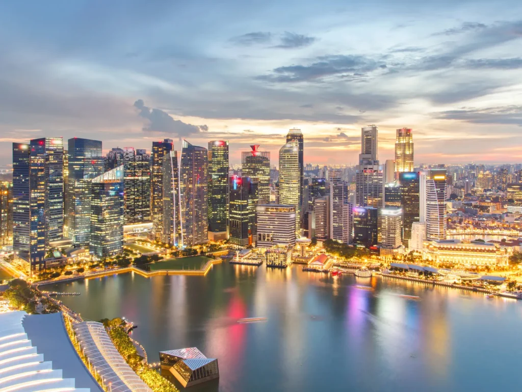 Colourful lights architecture business building and financial district in sunset time at singapore city.