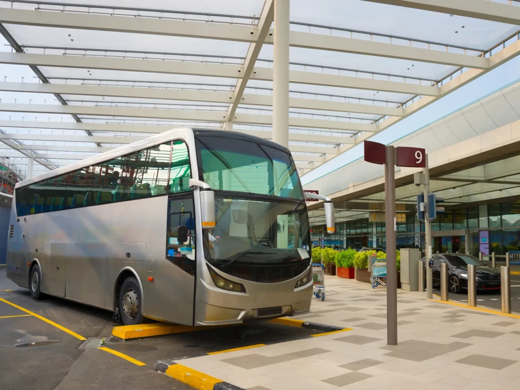 Bus on a parking lot at Singapore airport terminal.