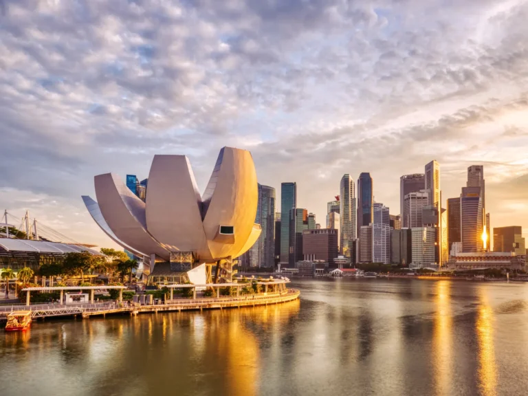 Singapore city skyline view from marina bay during sunset.