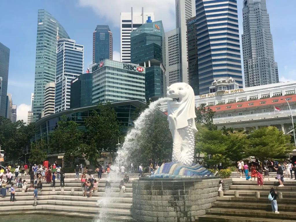 Merlion statue with Singapore financial district in the background.