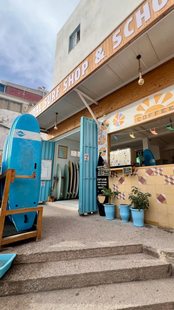Surf shop in Taghazout with surf boards outside.