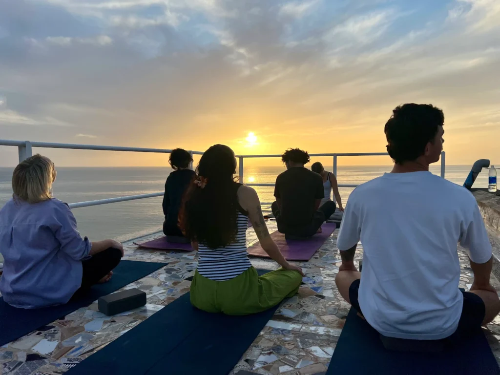 Sunset Yoga on the rooftop terrace at Surf Coast Morocco in Taghazout.