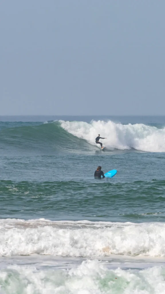 Man surfing a large wave off the coast of southern Morocco in Sidi Ifni.