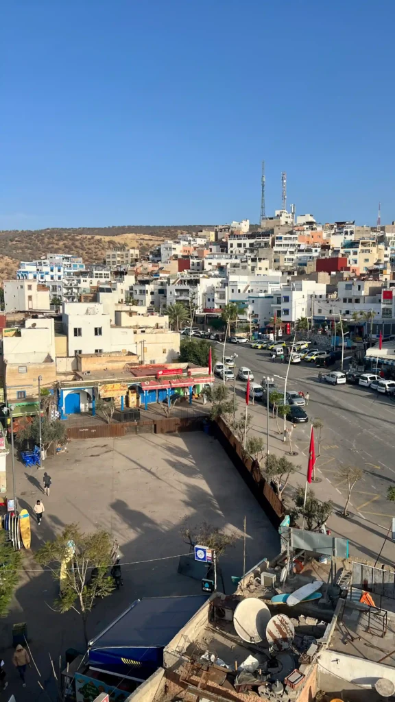 View over Taghazout market square on a bright, sunny day.
