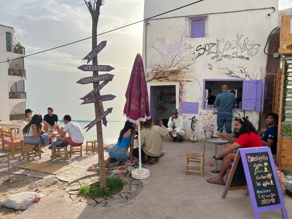 Sozi cookies in Taghazout showing facade of building and people sitting outside the cafe.