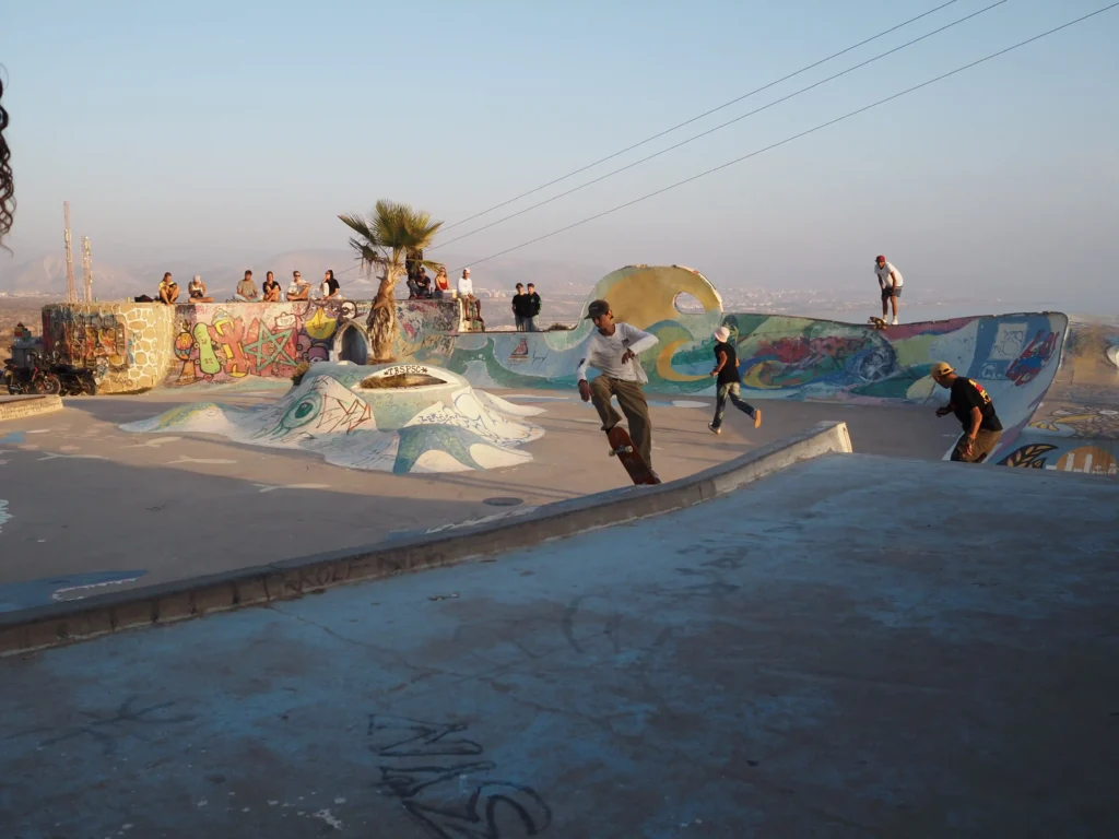 An open-air skate park by the sea at sunset in taghazout, morocco.